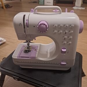 Compact White and Lavender Portable Sewing Machine